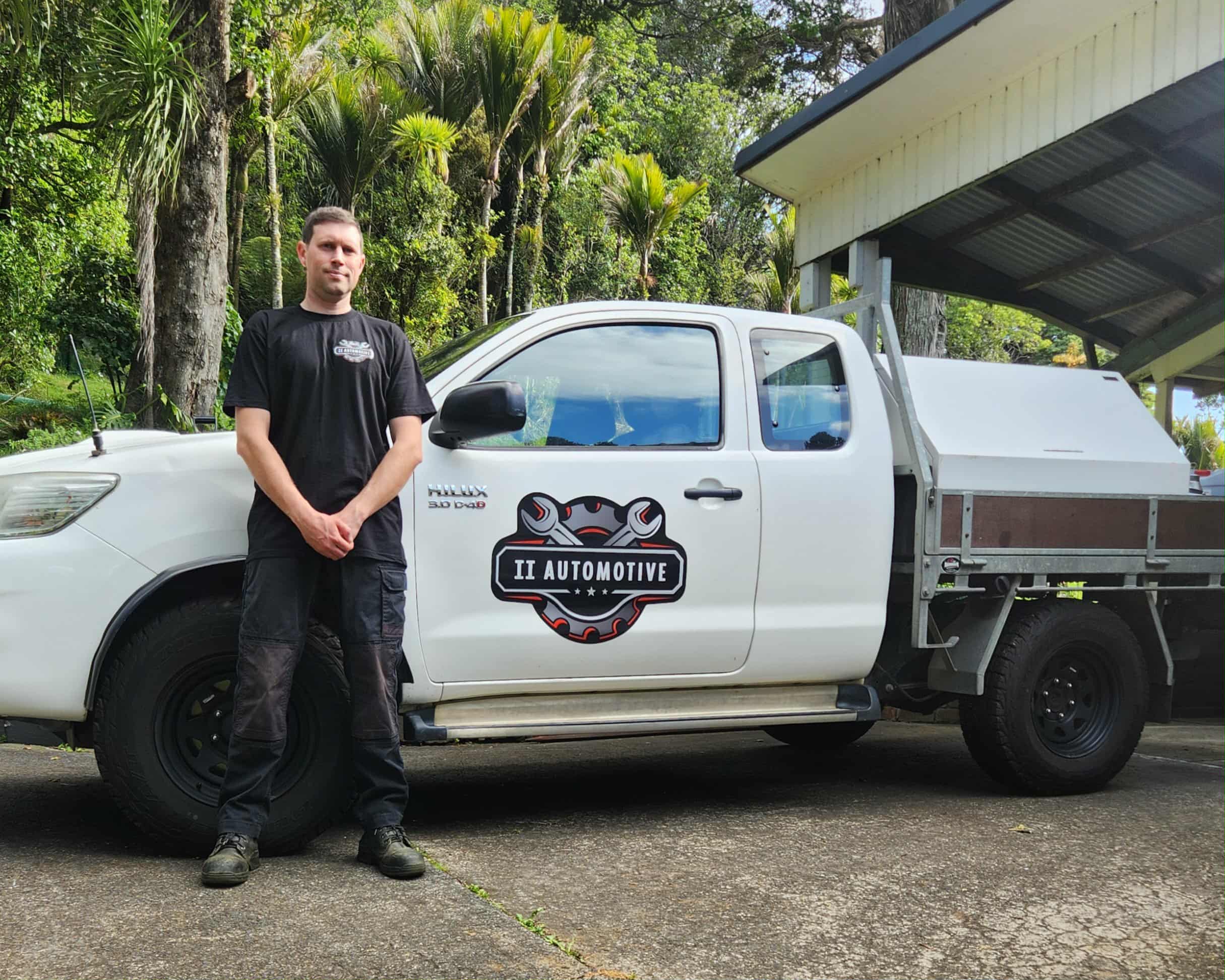 Mobile mechanic working at a customer's car.